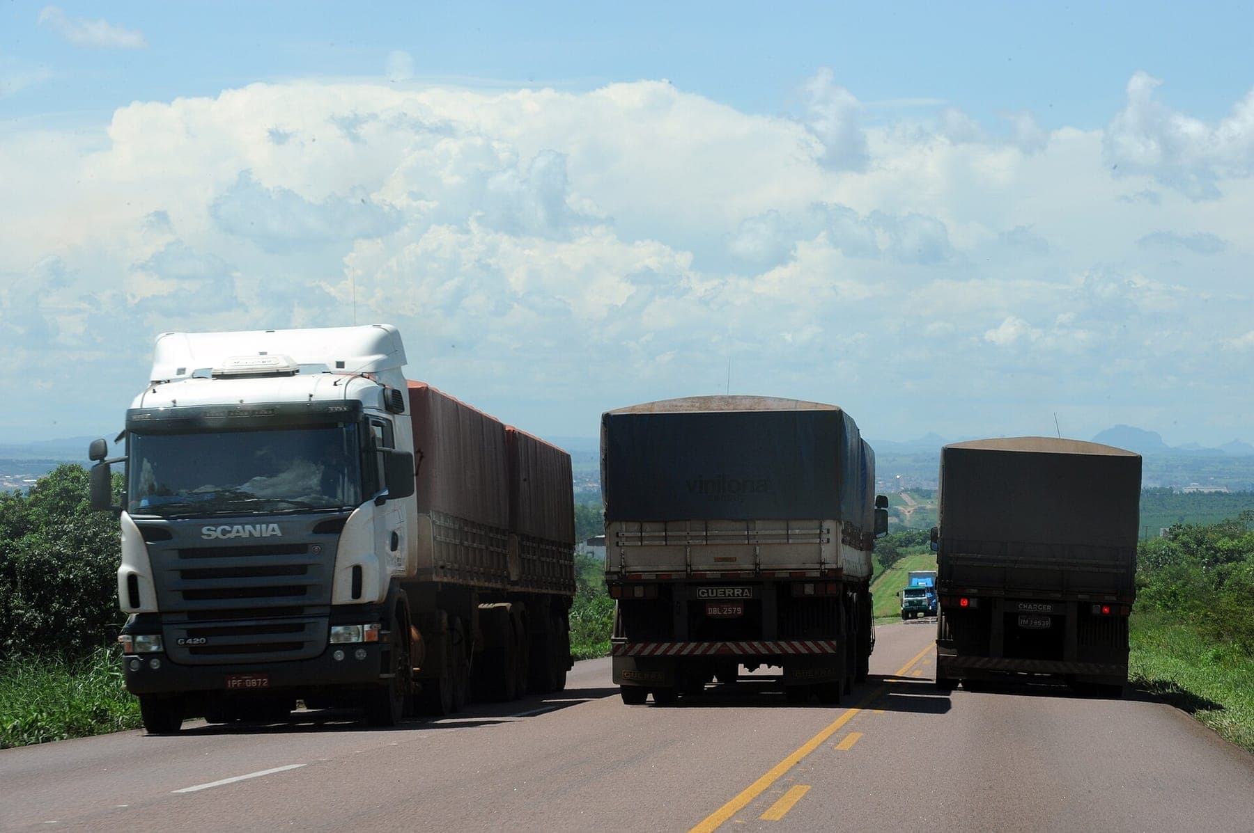 Trucks queued to load grain on a Brazilian highway