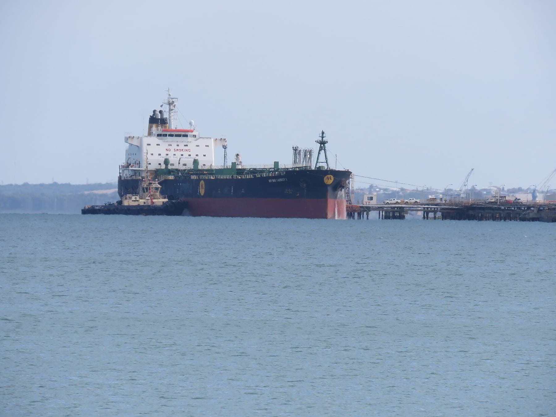An oil products tanker moored at a refinery jetty
